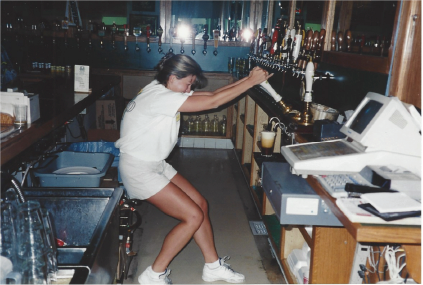 Photo of woman pouring cask beer at SDBC.