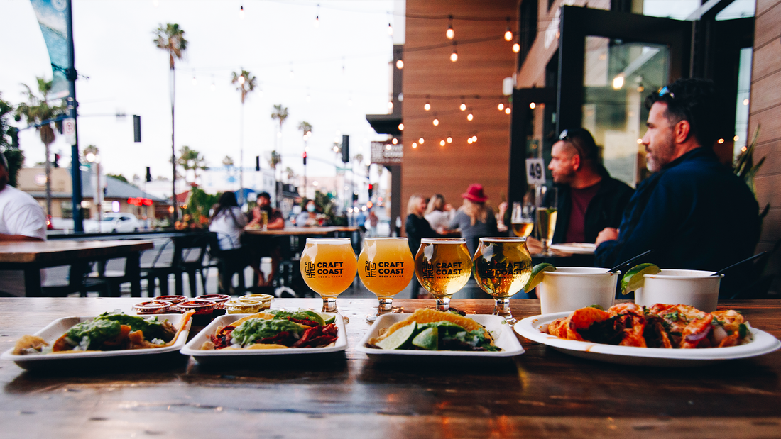 Picture of Craft Coast Beer & Tacos outdoor patio with table of tacos and beer