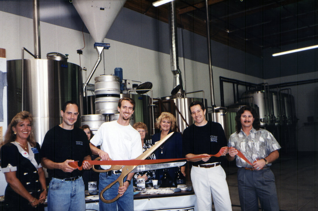 Ribbon cutting at original Stone Brewing with employees