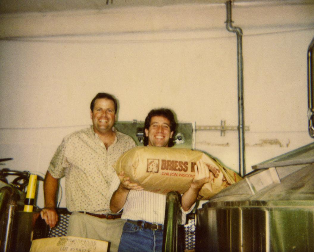 Photo of Chris Cramer and Matt Rattner brewing beer