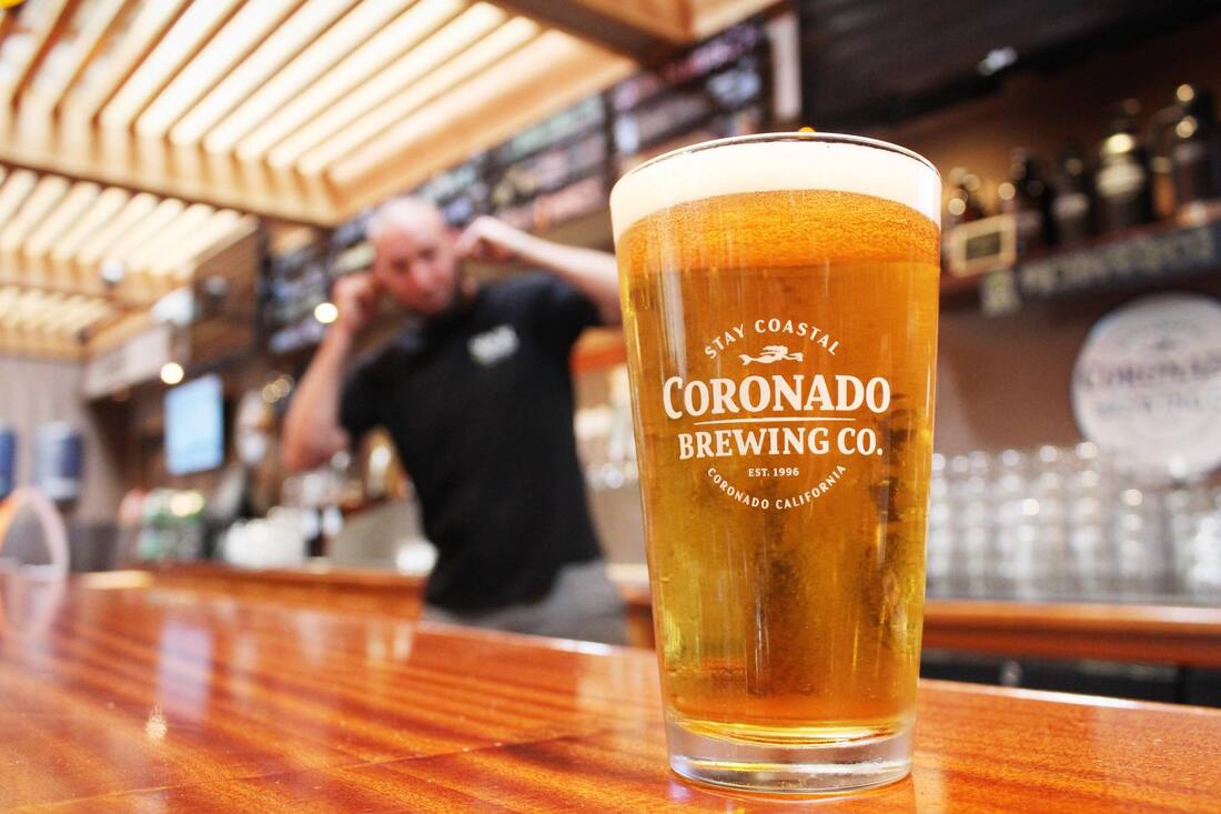 Picture of bartender with Coronado Brewing Co. pint glass