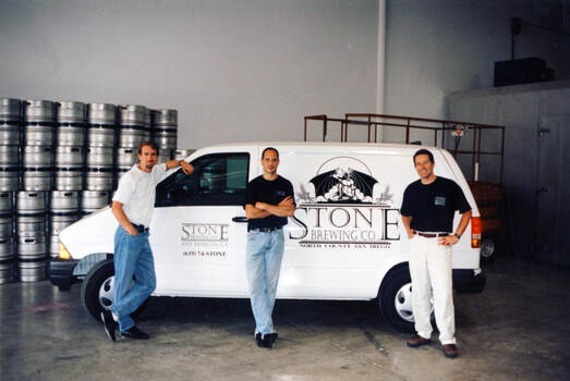 Picture of Stone employees in front of distribution van