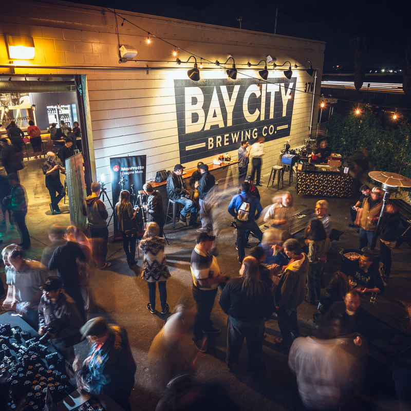 Picture of ourtdoor patio of Bay City Brewing with people