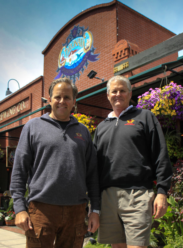 Rick and Ron Chapman standing in front of original location